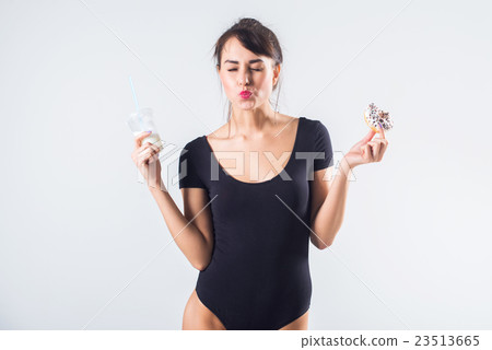 Young brunette model with cocktail and donut Young brunette model with cocktail and donut 23513665