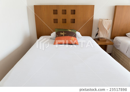pillow and bed in hotel room 23517898