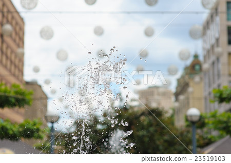 Splashes of water in city fountain 23519103