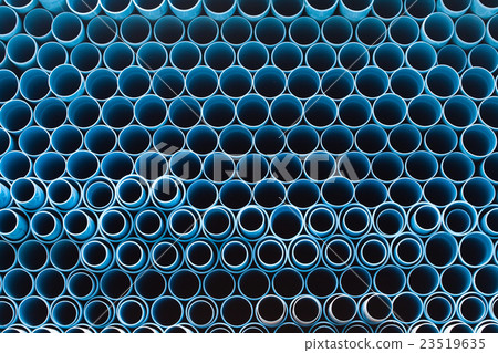 Stacks of blue PVC water pipes 23519635