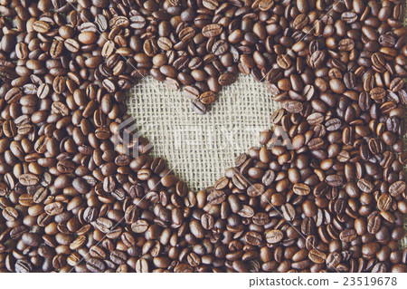 Coffee beans background with burlap heart frame Coffee beans background with burlap heart frame 23519678
