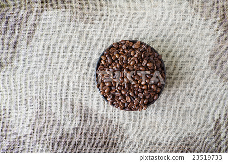Burlap texture with coffee beans heart shape Burlap texture with coffee beans heart shape 23519733