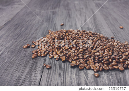 Coffee beans on wood background Coffee beans on wood background 23519737