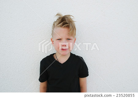 young emotional boy on bright background 23520855