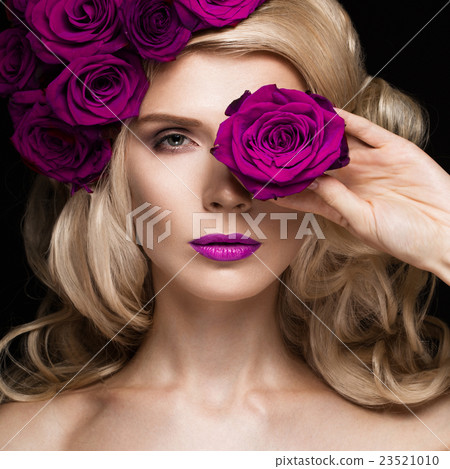 Beautiful blond girl in dress and hat with roses 23521010