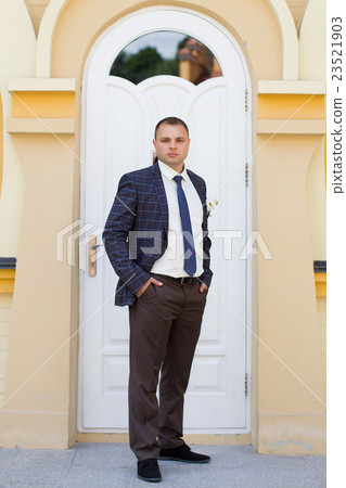 Confident bride in an expensive suit 23521903