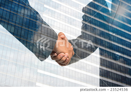 Double exposure handshake between businessman on Modern glass building background Double exposure handshake between businessman on Modern glass building background 23524536