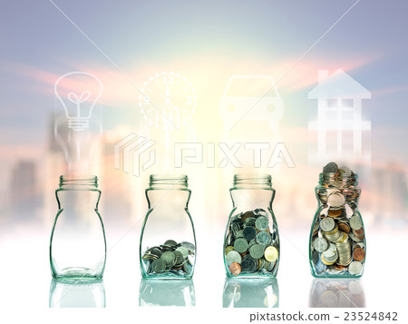 Mix coins and seed in clear bottle on cityscape photo blurred cityscape background with sign shape,Business investment growth concept 23524842