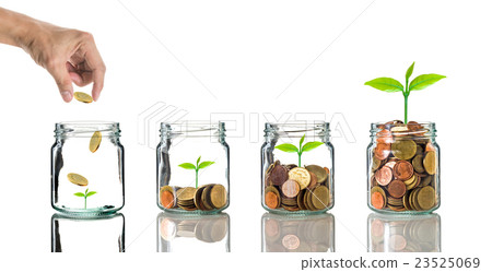 Hand putting gold coins into clear bottle on white background,Business investment growth concept Hand putting gold coins into clear bottle on white background,Business investment growth concept 23525069
