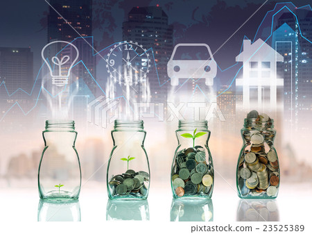 Mix coins and seed in clear bottle on trading graph with cityscape background with sign shape,Business investment growth concept 23525389