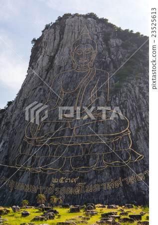Closeup gold painting of buddha statue on the cliff at Cheechan temple, Chonburi province,Thailand, public domain Closeup gold painting of buddha statue on the cliff at Cheechan temple, Chonburi province,Thailand, public domain 23525613