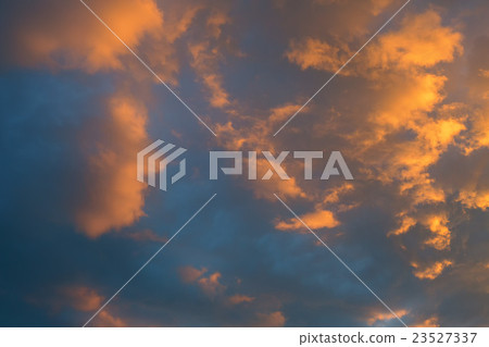 Beautiful clouds illuminated by setting sun in the Beautiful clouds illuminated by setting sun in the 23527337