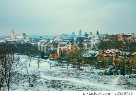 Panoramic view at Vilnius city in blizzard 23529756