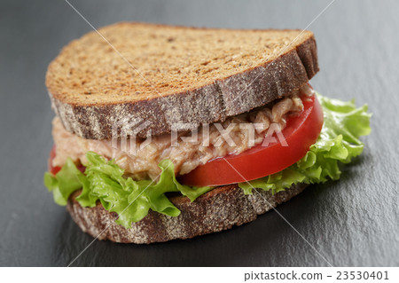 Sandwich with tuna and vegetables on rye bread Sandwich with tuna and vegetables on rye bread 23530401