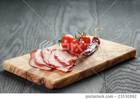 smoked ham prsut with cherry tomatoes and chili smoked ham prsut with cherry tomatoes and chili 23530892
