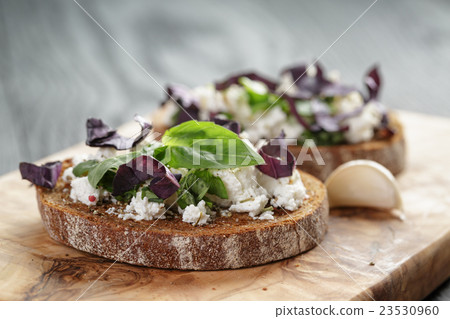 rye sandwich or bruschetta with ricotta, herbs and 23530960