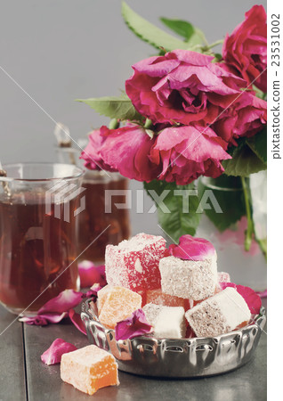 glass of Turkish tea and rahat Delight 23531002