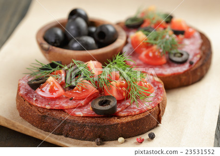 open rye sandwich with salami and vegetables 23531552