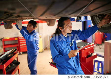 Working in garage Working in garage 23534075