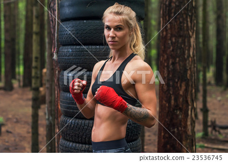 Woman boxer professional fighter posing in boxing 23536745