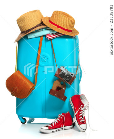 The blue suitcase, sneakers, clothing, hat, and 23538793