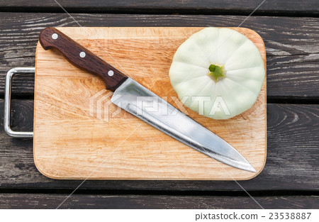 Squash on a cutting board wooden background with Squash on a cutting board wooden background with 23538887