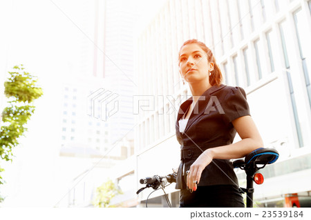 Young woman commuting on bicycle 23539184