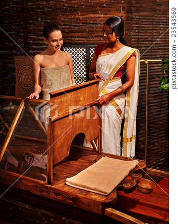 Woman having India sauna. 23543569