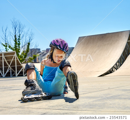 Girl riding on roller skates in skatepark. Girl riding on roller skates in skatepark. 23543571