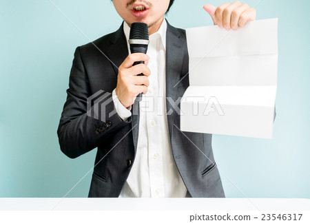 A man with white paper 23546317
