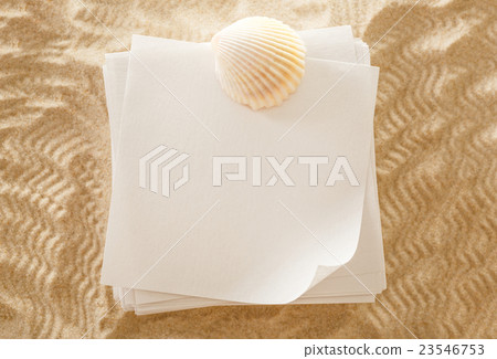Blank white paper and seashell in sand Blank white paper and seashell in sand 23546753