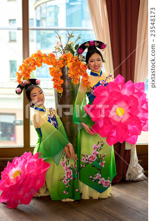 two chinese women in traditional dresses two chinese women in traditional dresses 23548173