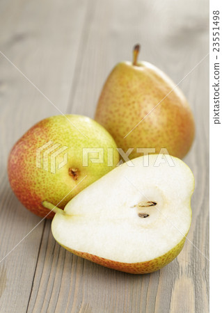 three ripe pears on wood table three ripe pears on wood table 23551498