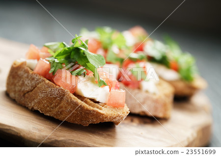 rye bruschetta with mozzarella, tomatoes rye bruschetta with mozzarella, tomatoes 23551699