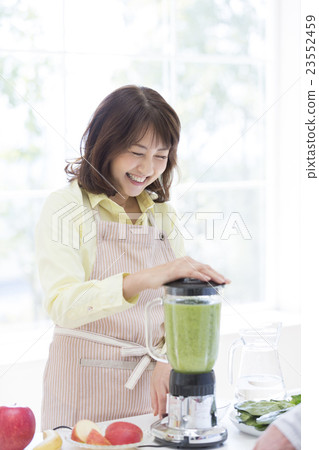 Middle-aged and aged women standing in the kitchen Middle-aged and aged women standing in the kitchen 23552459