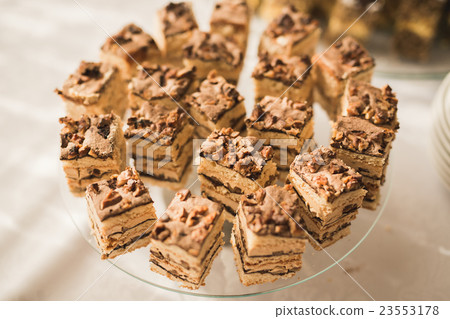 Different kinds of baked sweets on a buffet Different kinds of baked sweets on a buffet 23553178