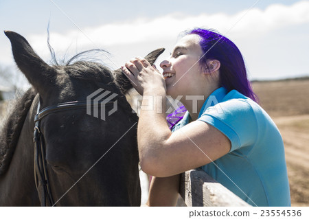 Beautiful teen girl on the farm with her horse. Beautiful teen girl on the farm with her horse. 23554536