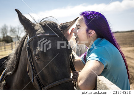 Beautiful teen girl on the farm with her horse. Beautiful teen girl on the farm with her horse. 23554538