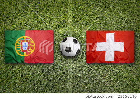 Portugal vs. Switzerland flags on soccer field 23556186