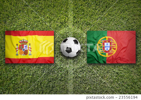 Spain vs. Portugal flags on soccer field 23556194