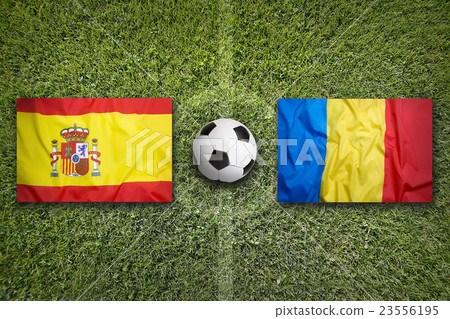 Spain vs. Romania flags on soccer field Spain vs. Romania flags on soccer field 23556195