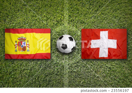 Spain vs. Switzerland flags on soccer field Spain vs. Switzerland flags on soccer field 23556197