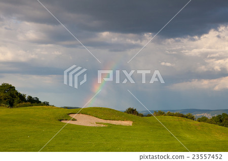 Rainbow on the empty driving range 23557452