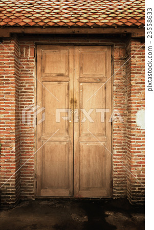 Old brown wooden door 23558633