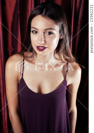 young pretty stylish woman fancy dressed at red young pretty stylish woman fancy dressed at red 23562231