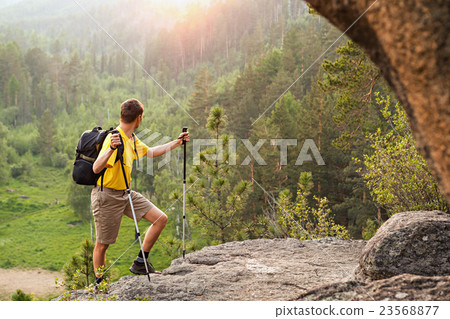 Backpacker go up mountain 23568877