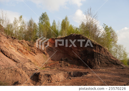 Waste heaps of red rock in industrial district Waste heaps of red rock in industrial district 23570226