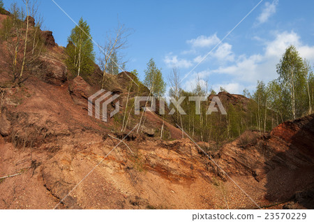 Waste heaps of red rock in industrial district Waste heaps of red rock in industrial district 23570229
