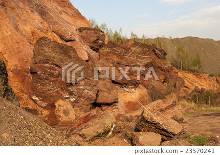 Waste heaps of red rock in industrial district Waste heaps of red rock in industrial district 23570241