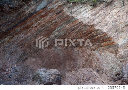 Waste heaps of red rock in industrial district 23570245